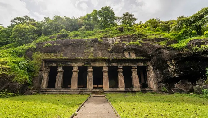 Rock-cut Elephanta Caves surrounded by greenery