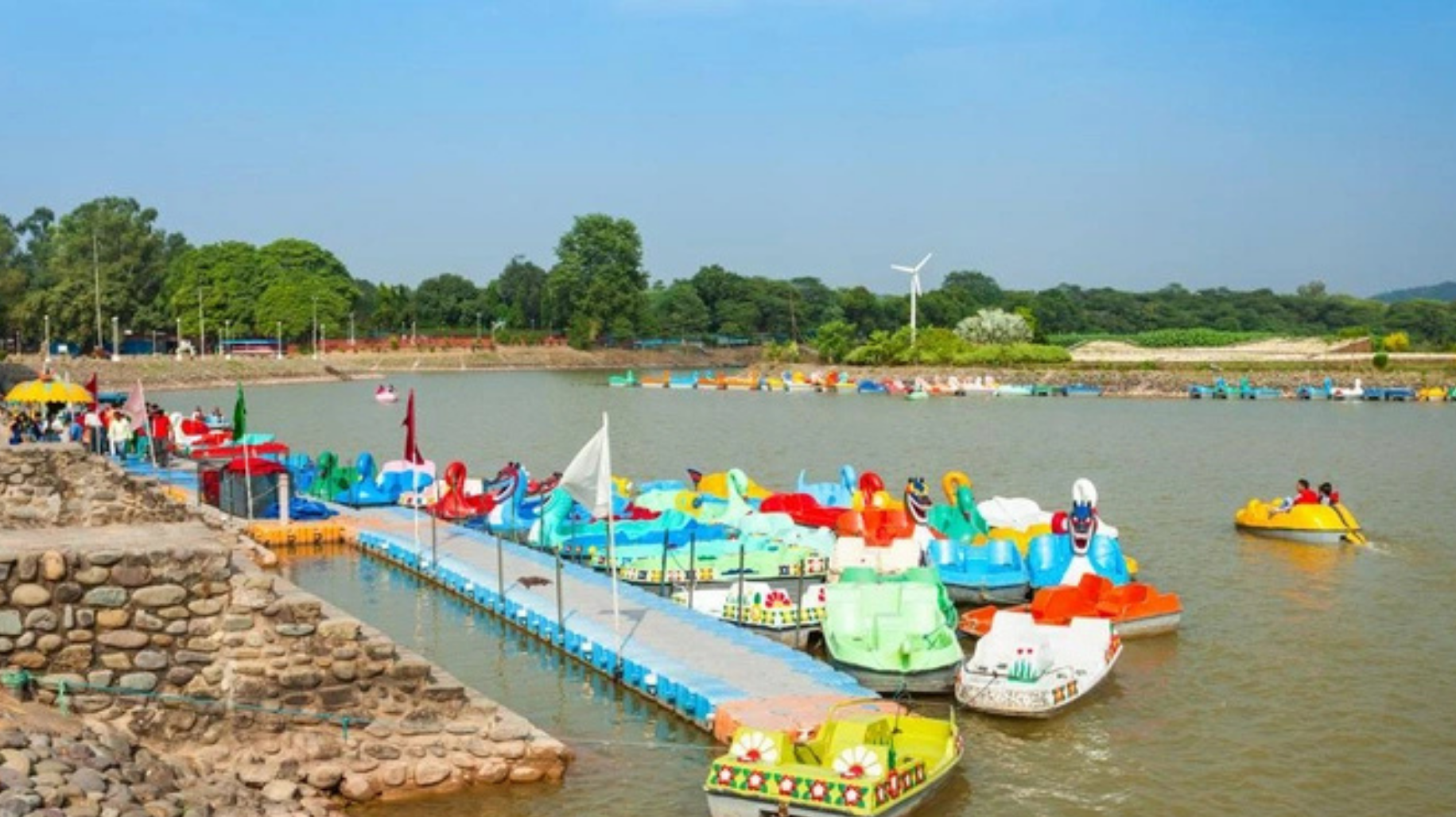 Sukhna Lake promenade with serene waters and walkers